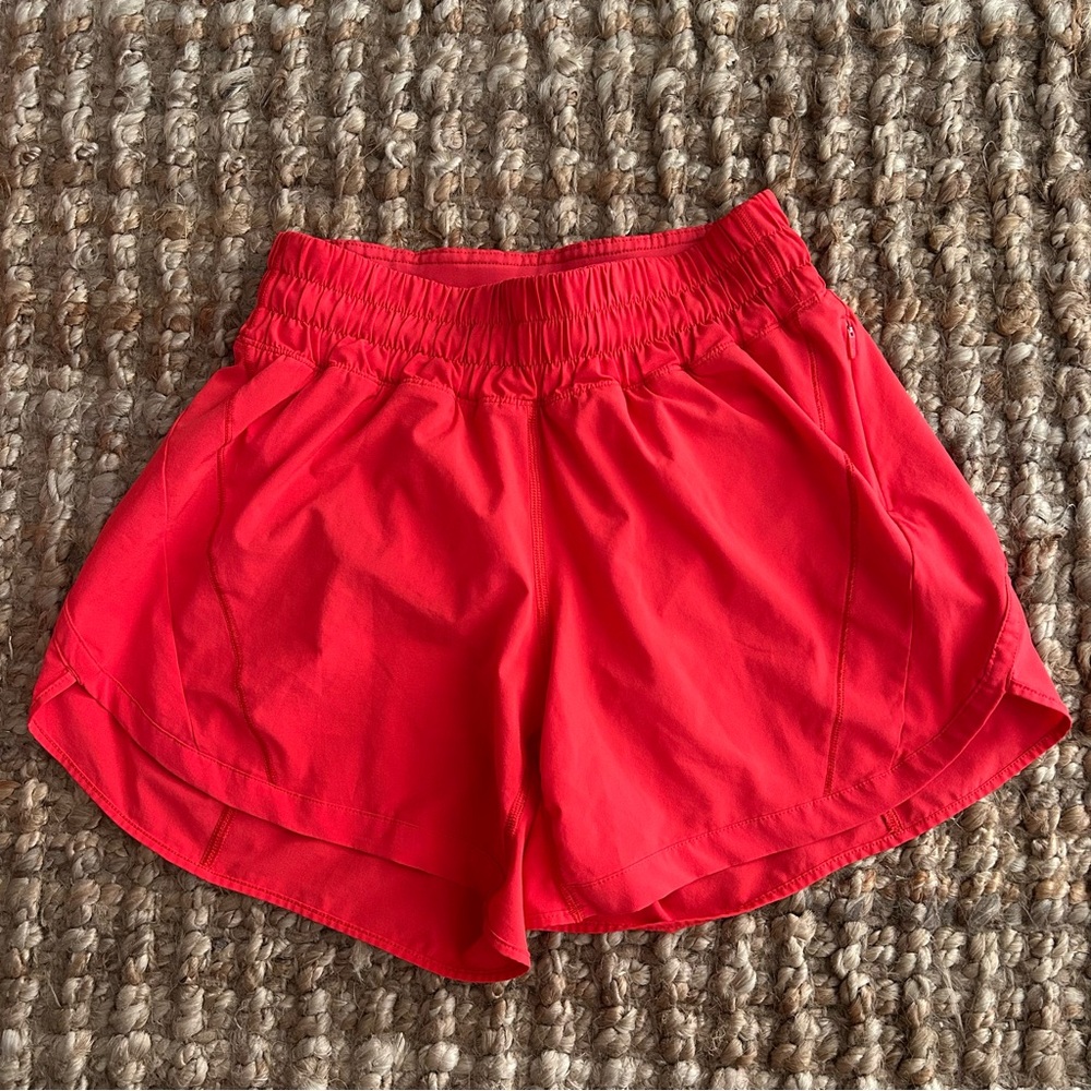 Lululemon track that 5” high rise lined shorts in red